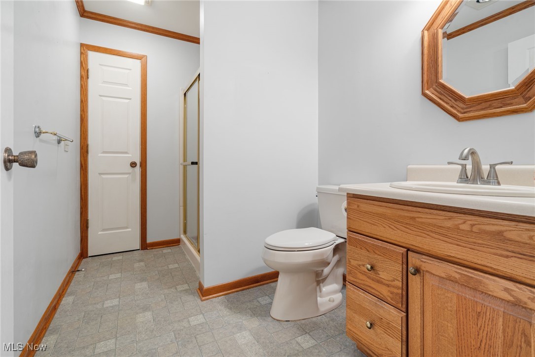 14265 Reeder Avenue Northeast Alliance, OH 44601 - Photo 12 of 39 Bathroom featuring vanity, a shower stall, and ornamental molding