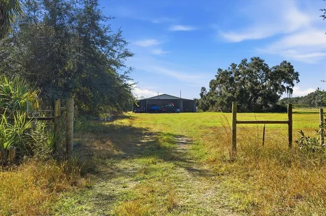 a swimming pool with an outdoor space and seating area