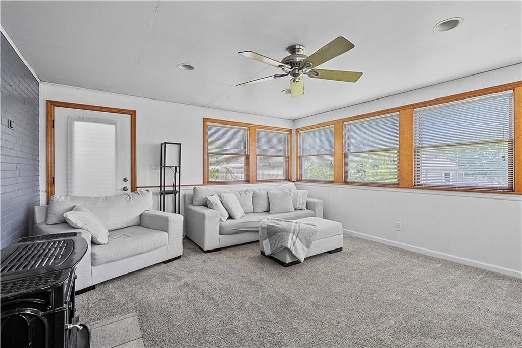 102 Adele Avenue Pittsburgh, PA 15223 - Photo 13 of 23 a living room with furniture and a large window