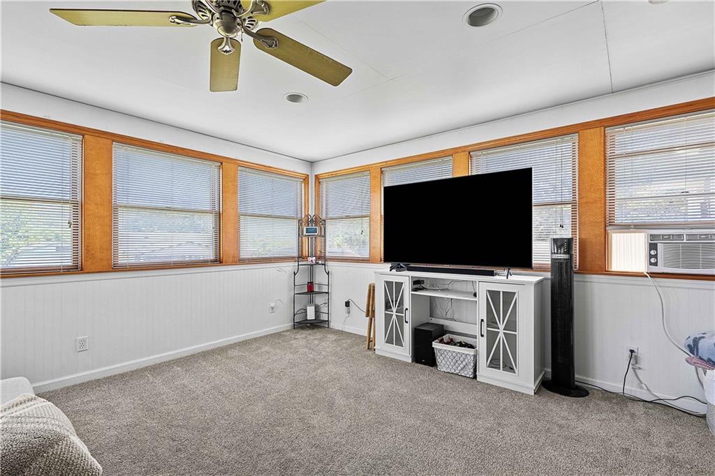 102 Adele Avenue Pittsburgh, PA 15223 - Photo 15 of 23 a living room with furniture and a flat screen tv