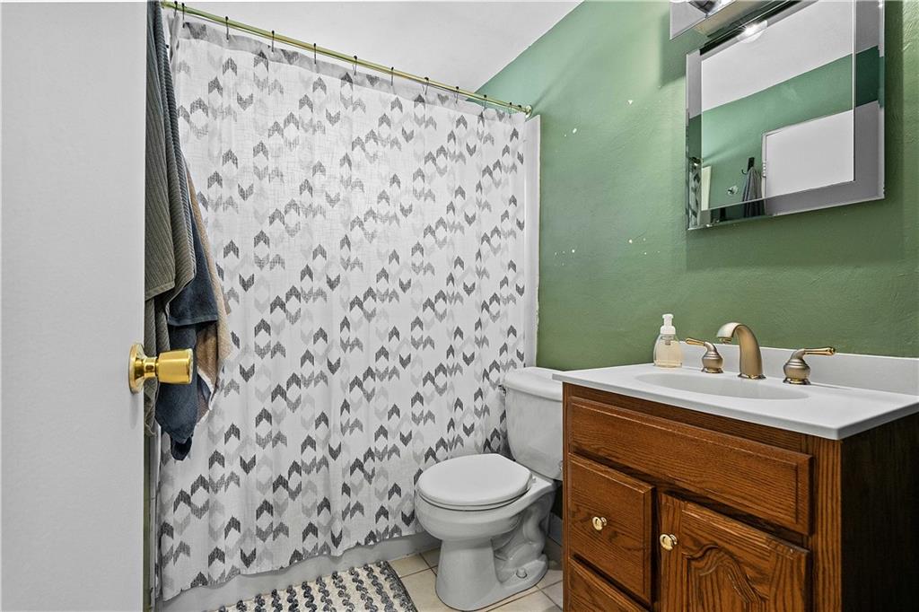 102 Adele Avenue Pittsburgh, PA 15223 - Photo 16 of 23 a bathroom with a sink and a toilet