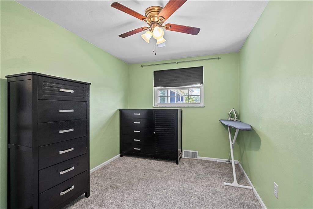 102 Adele Avenue Pittsburgh, PA 15223 - Photo 17 of 23 a bedroom with a bed and a ceiling fan