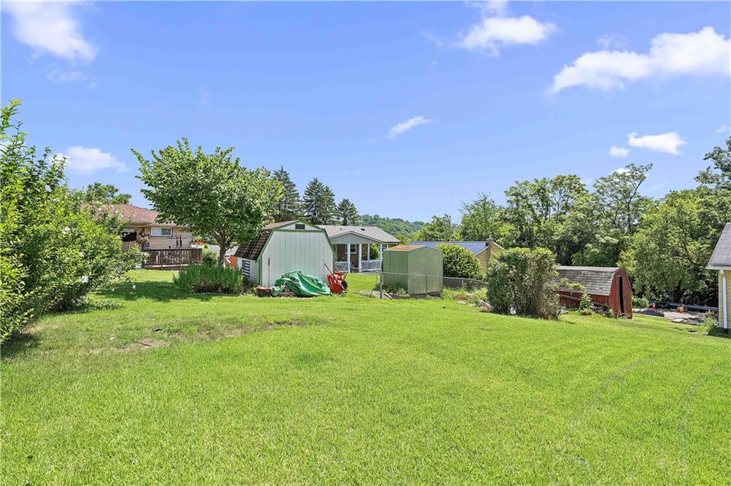102 Adele Avenue Pittsburgh, PA 15223 - Photo 6 of 23 a view of a house with a yard and sitting area