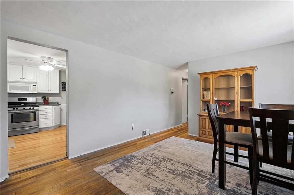 102 Adele Avenue Pittsburgh, PA 15223 - Photo 9 of 23 a view of a dining room with furniture and wooden floor