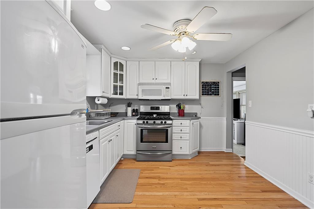102 Adele Avenue Pittsburgh, PA 15223 - Photo 10 of 23 a kitchen with stainless steel appliances granite countertop a stove cabinets and refrigerator