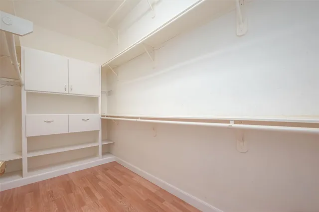 a view of an empty walk in closet