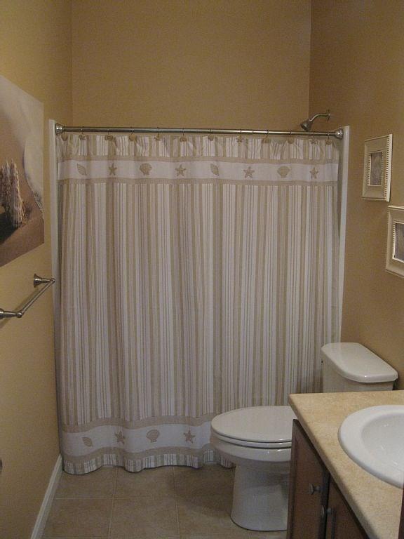 35 Barefoot Cottage Road, Unit 139 Wells, ME 04090 - Photo 9 of 17 Sandy colored and tiled floor bathroom.