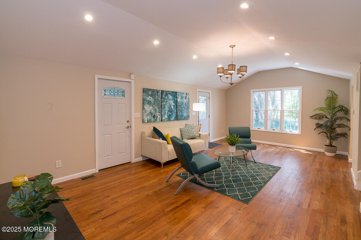 21 Wickatunk Road Manalapan, NJ 07726 - Photo 3 of 48 a living room with furniture window and wooden floor