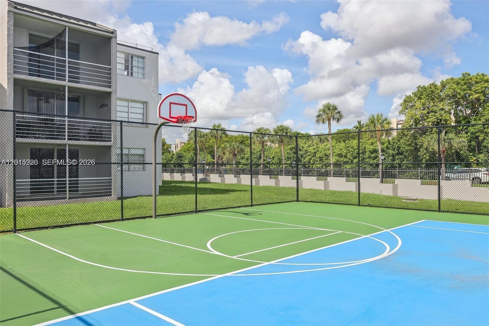 14170 Southwest 84th Street, Unit 404F Miami, FL 33183 - Photo 15 of 18 a view of a tennis court