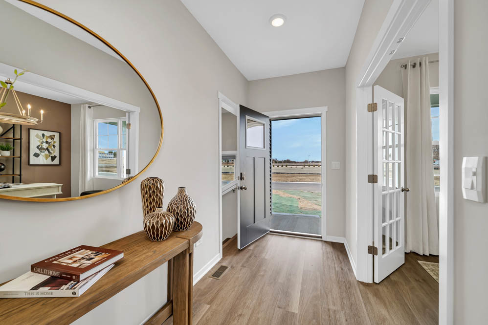 283 Snowdrop Lane Elgin, IL 60124 - Photo 2 of 38 a view of a hallway with workspace and closet with wooden floor