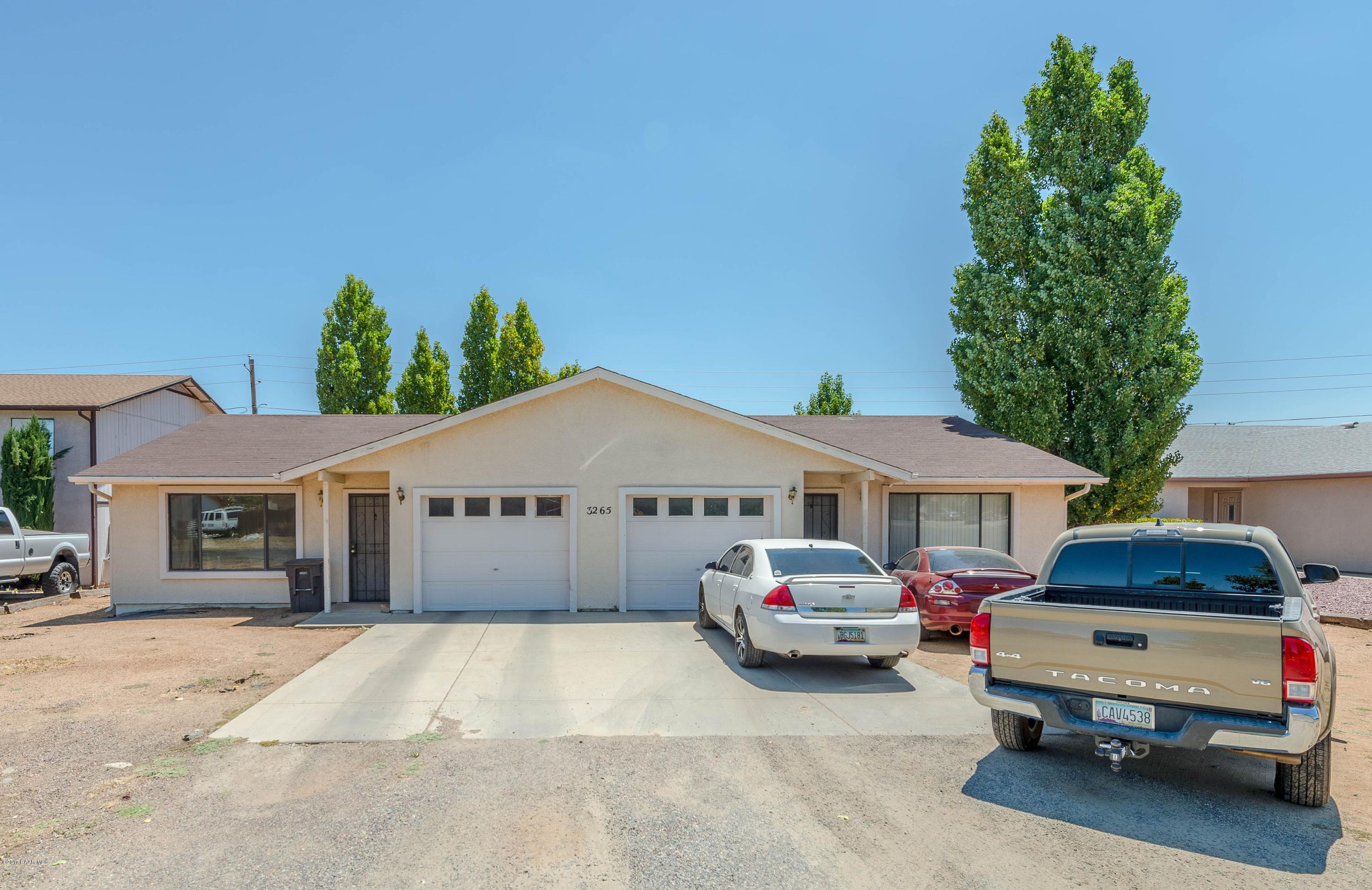 3265 North Yavapai Road East Prescott Valley, AZ 86314 - Photo 13 of 19 a car parked in front of white house