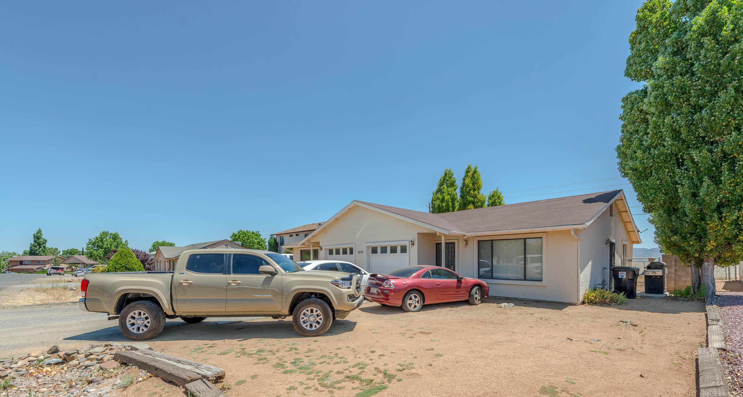 3265 North Yavapai Road East Prescott Valley, AZ 86314 - Photo 17 of 19 a view of a cars in front of a house