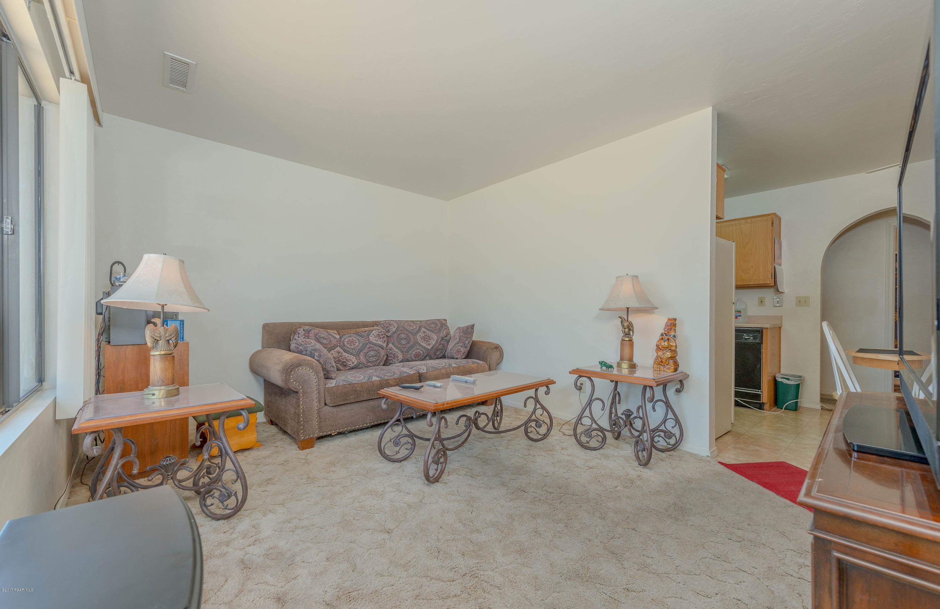 3265 North Yavapai Road East Prescott Valley, AZ 86314 - Photo 4 of 19 a living room with furniture and a flat screen tv