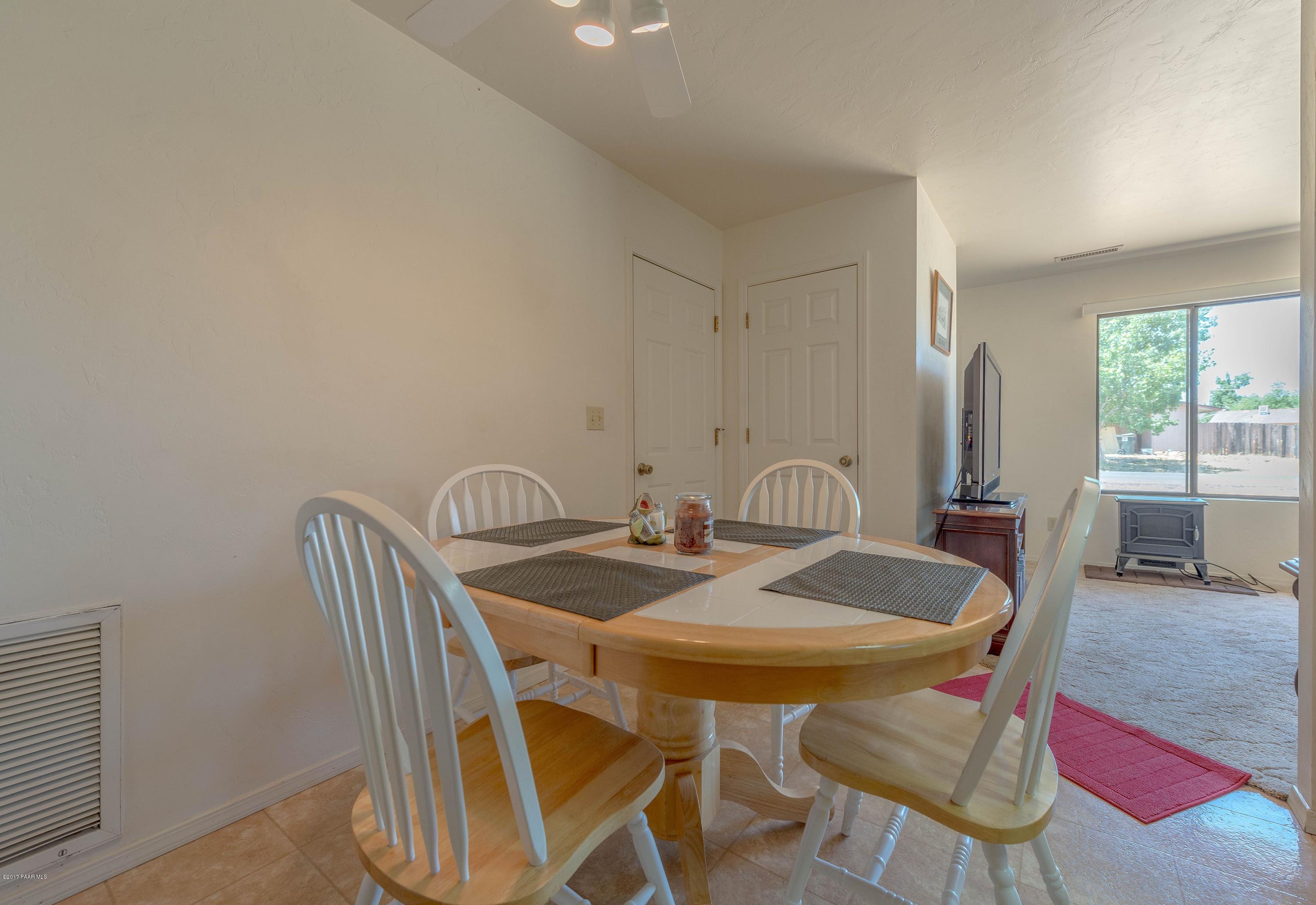 3265 North Yavapai Road East Prescott Valley, AZ 86314 - Photo 9 of 19 a view of a dining room with furniture