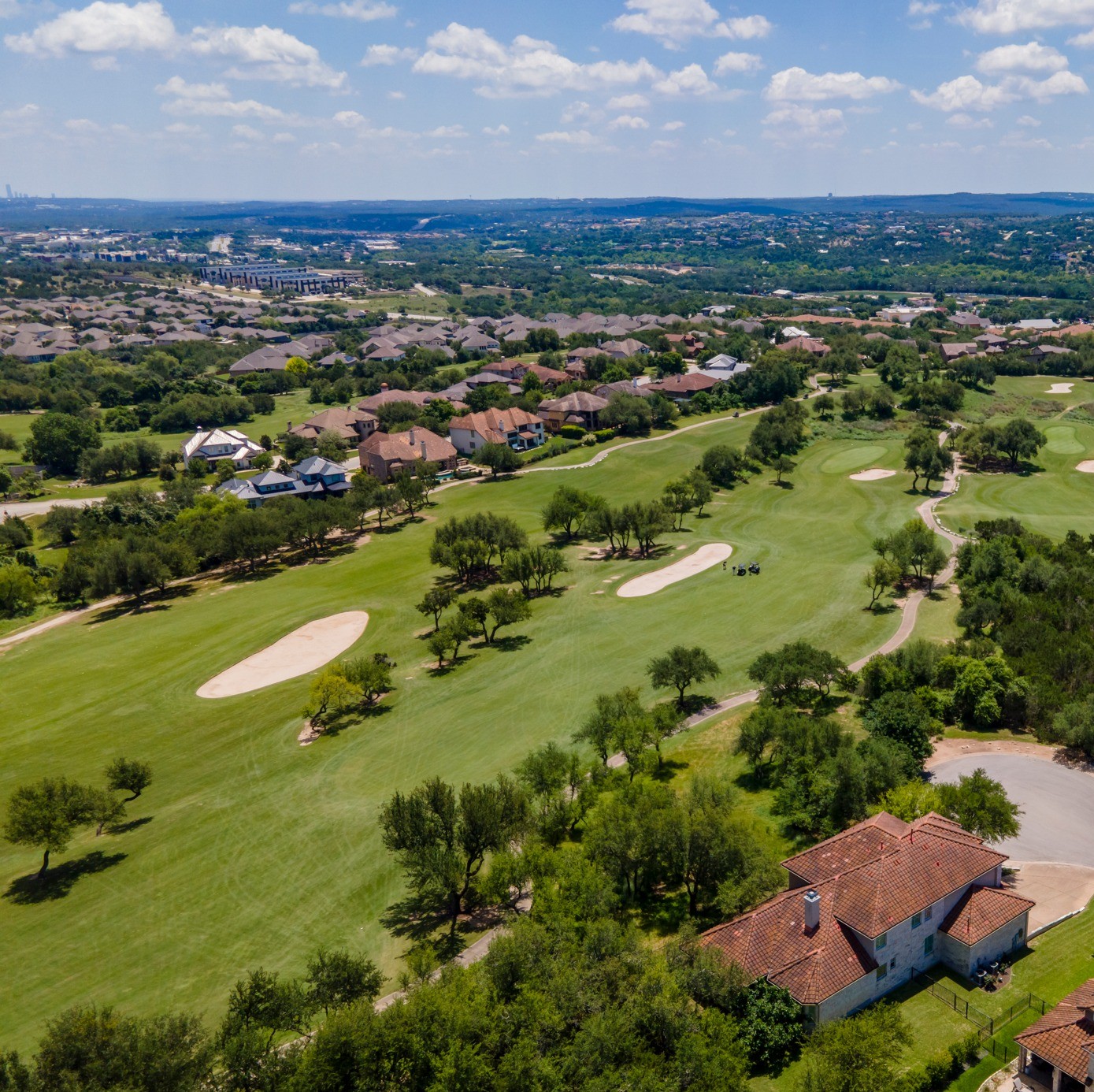 14608 Spillman Ranch Loop Austin, TX 78738 - Photo 2 of 31 an aerial view of residential houses with outdoor space and ocean view