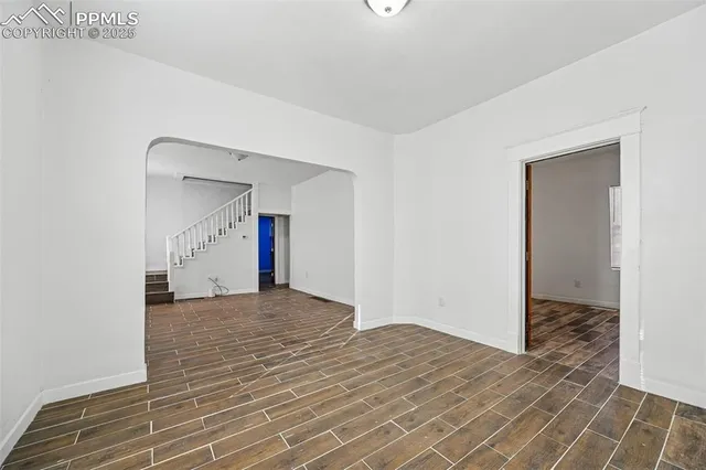 a view of a livingroom from a hallway