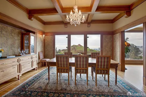 a kitchen with stainless steel appliances granite countertop a stove and a wooden floors