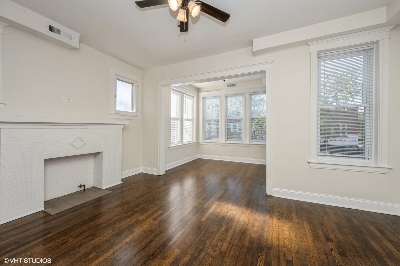 4954 West Augusta Boulevard, Unit 1 Chicago, IL 60651 - Photo 15 of 15 a view of an empty room with wooden floor and a window