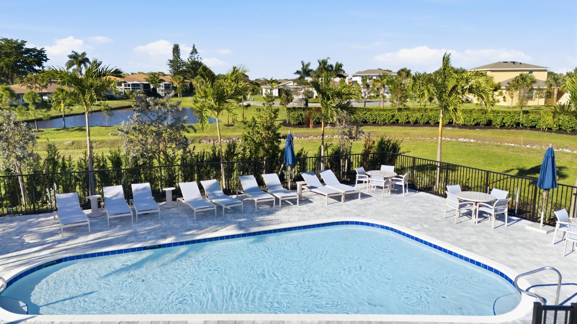 13670 Vía Flora, Unit B Delray Beach, FL 33484 - Photo 27 of 36 a view of a lake with a table and chairs