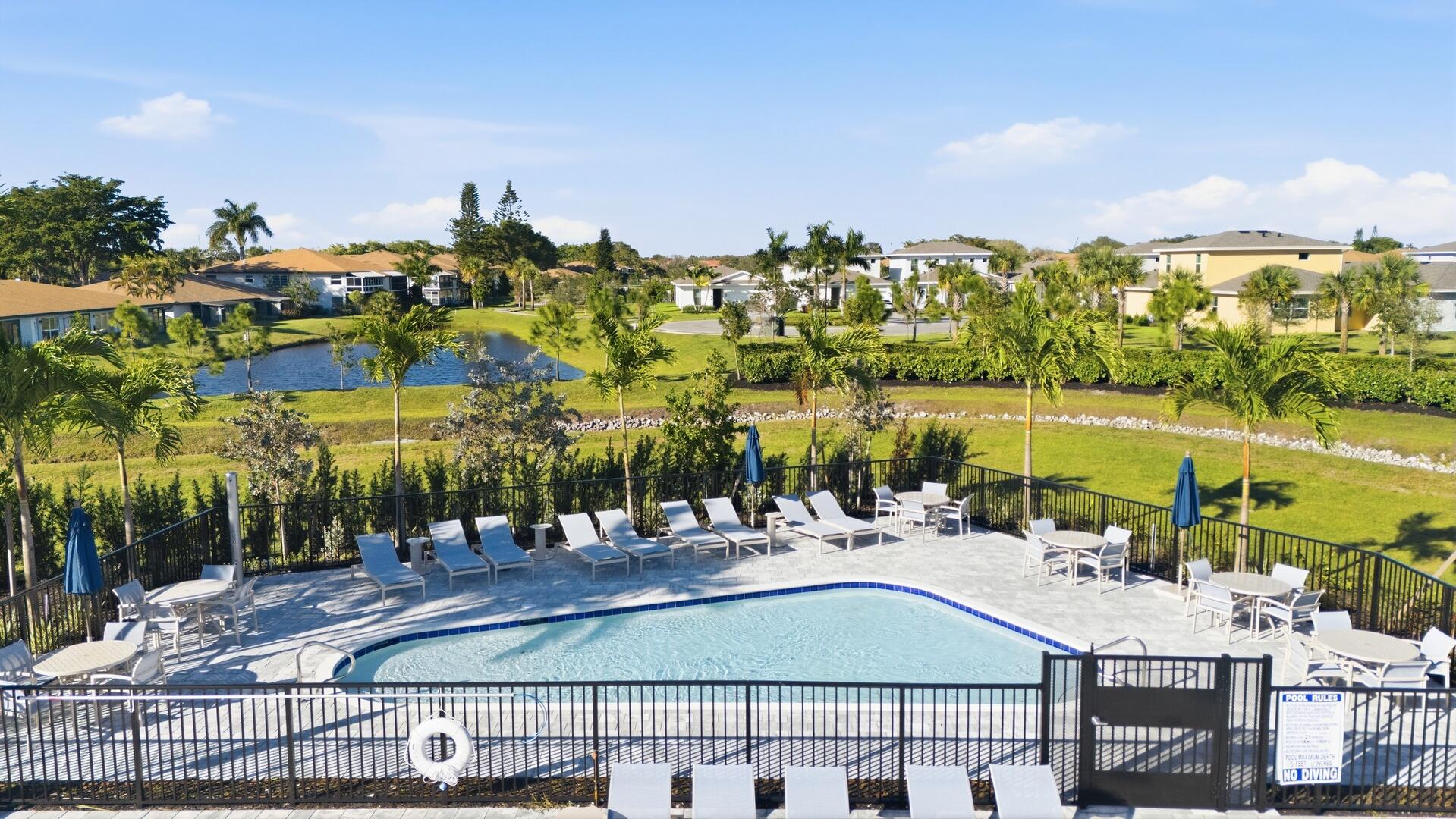 13670 Vía Flora, Unit B Delray Beach, FL 33484 - Photo 29 of 36 a aerial view of multiple houses with yard