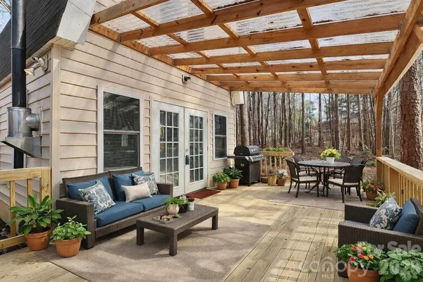 a outdoor living space with patio furniture and garden view