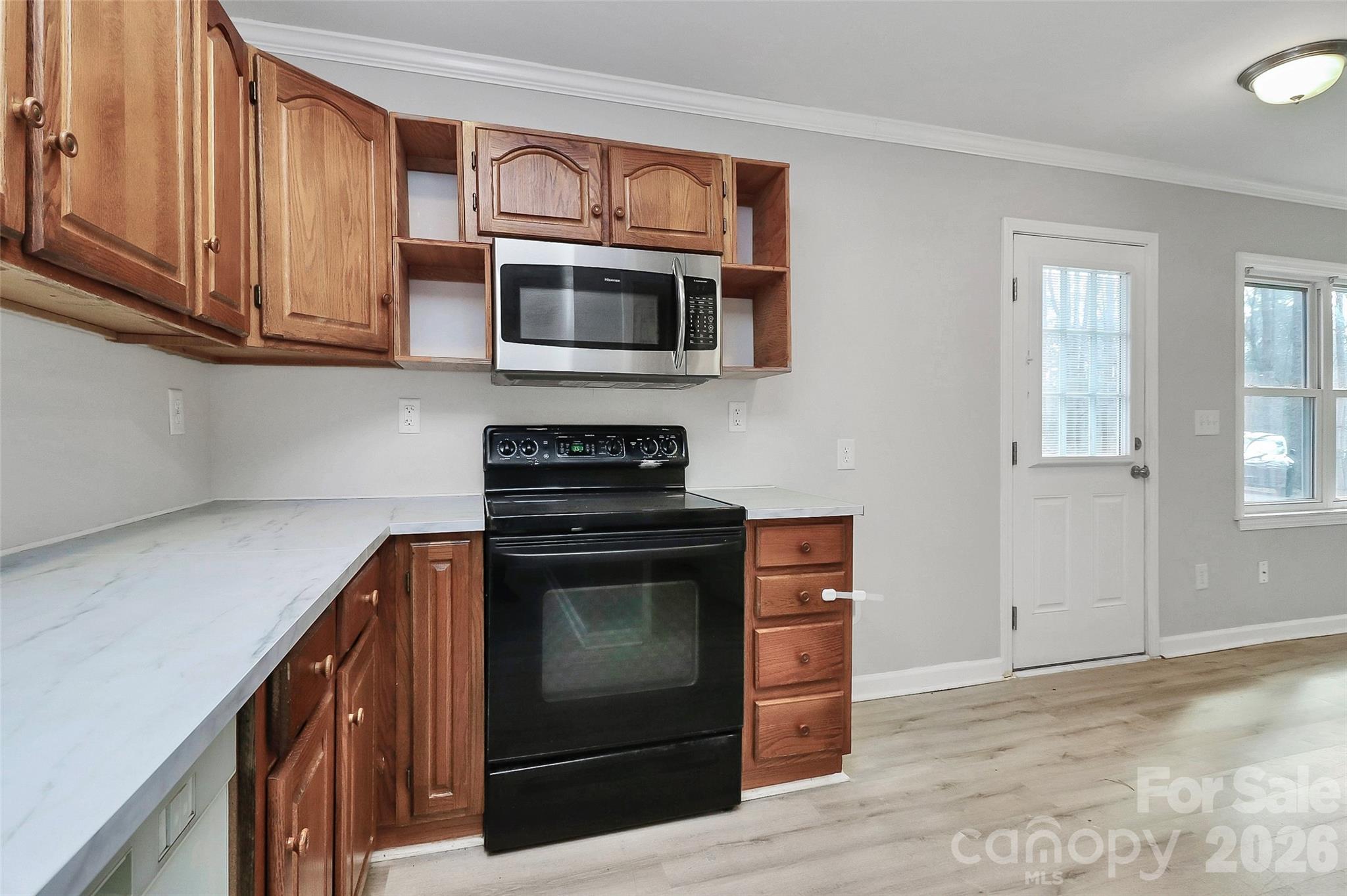 8591 Bartlett Road Mint Hill, NC 28227 - Photo 14 of 45 a kitchen with stainless steel appliances granite countertop a stove and a microwave