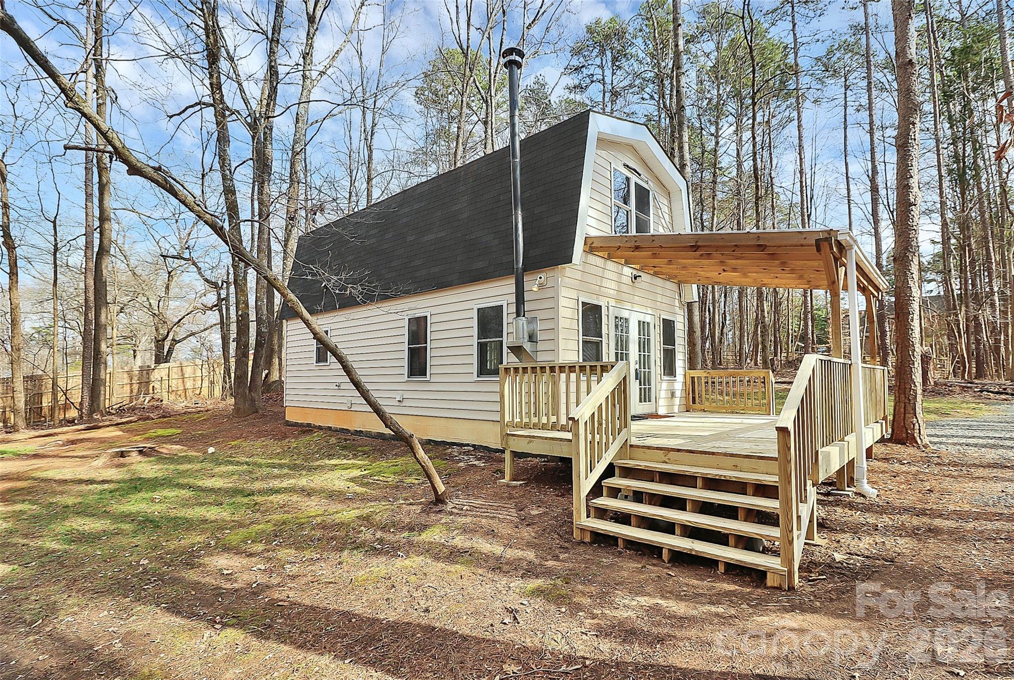 8591 Bartlett Road Mint Hill, NC 28227 - Photo 28 of 45 a view of a house with a yard