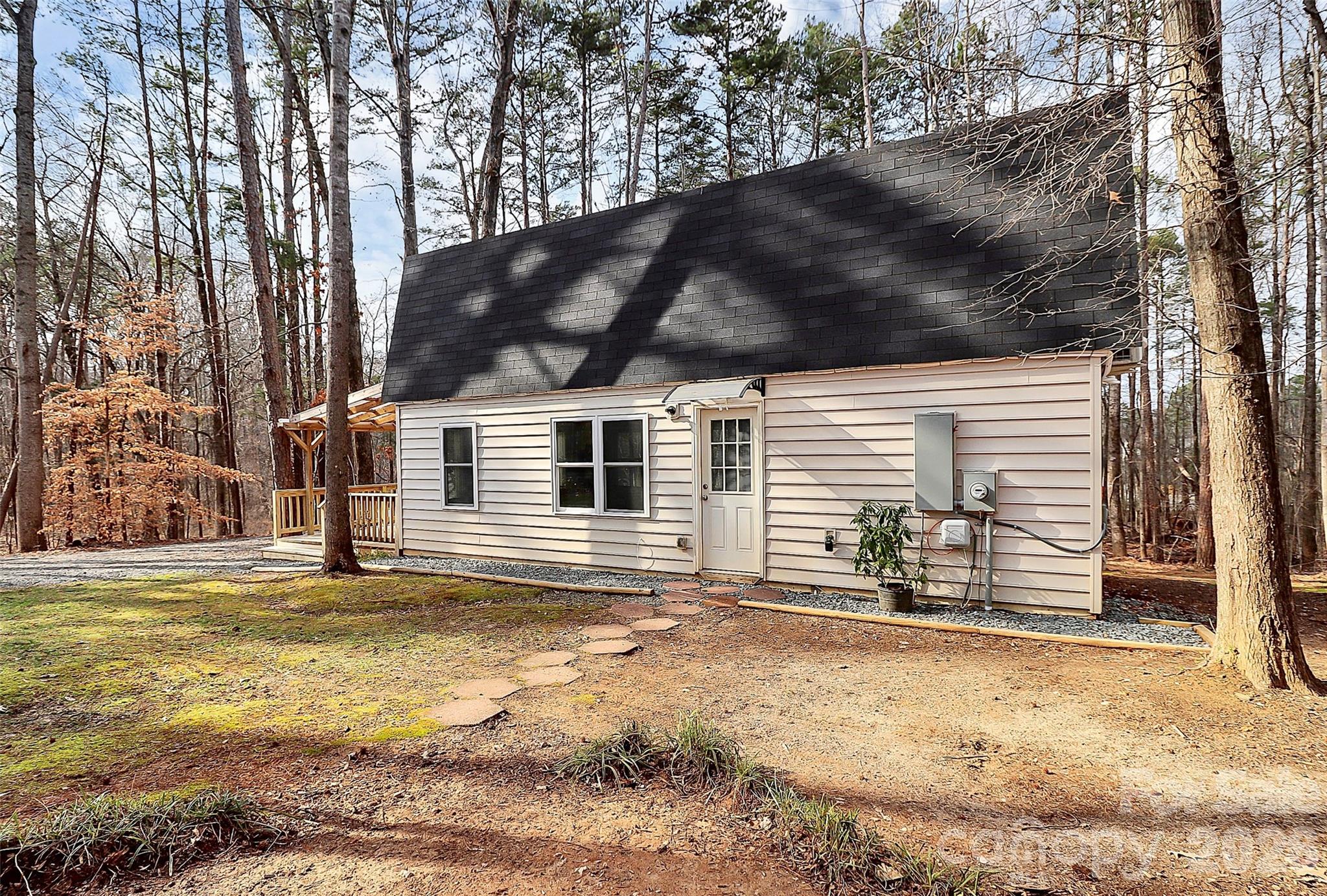 8591 Bartlett Road Mint Hill, NC 28227 - Photo 32 of 45 a view of a house with a yard