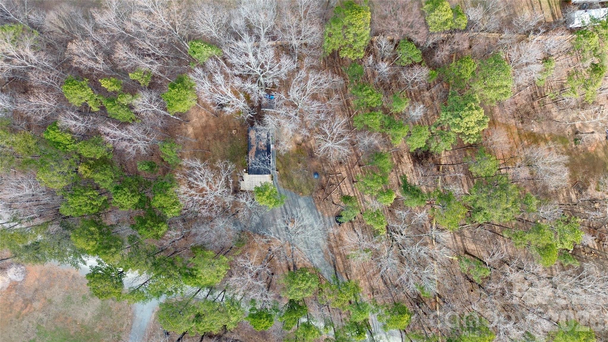 8591 Bartlett Road Mint Hill, NC 28227 - Photo 40 of 45 a backyard of a house with lots of green space