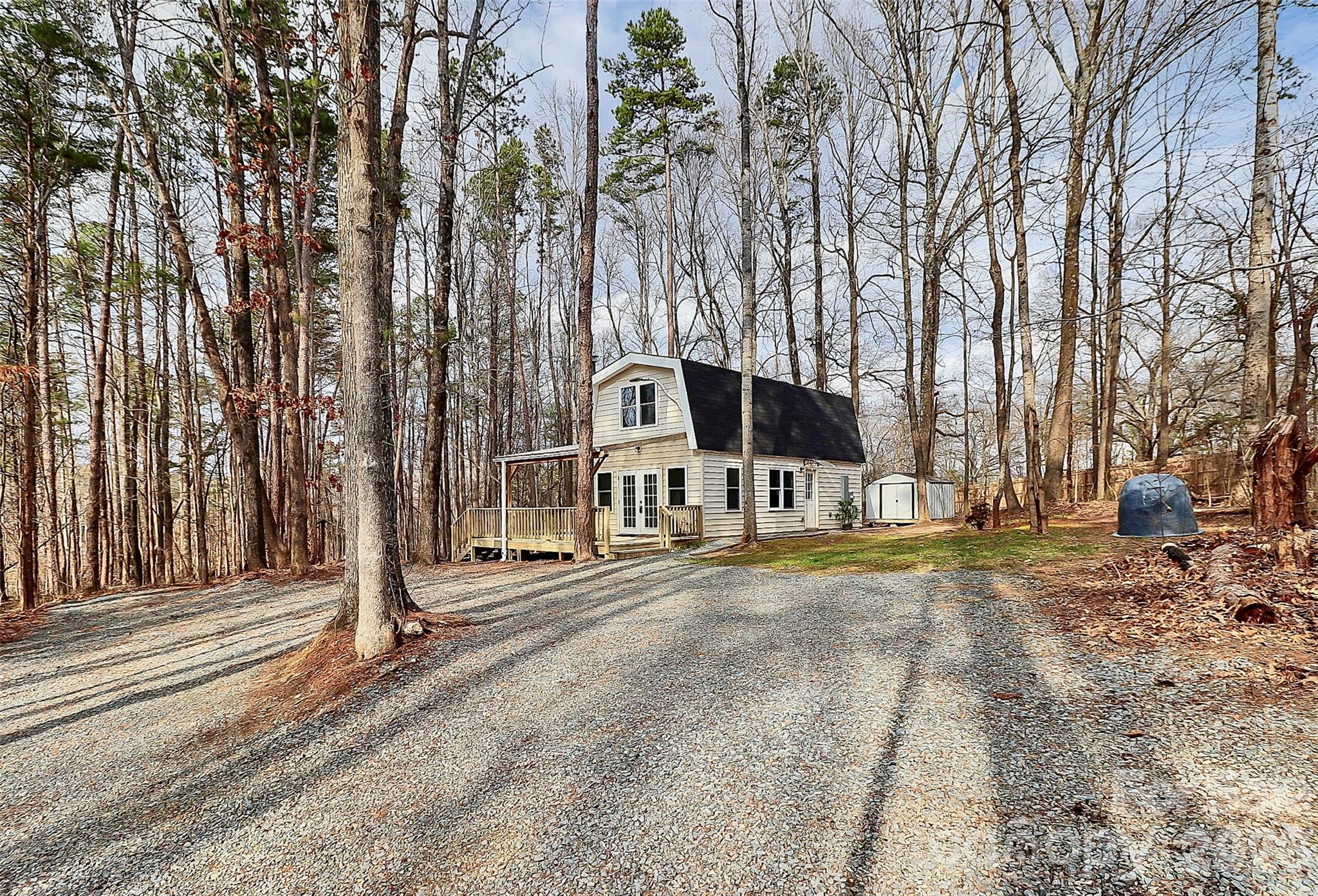 8591 Bartlett Road Mint Hill, NC 28227 - Photo 4 of 45 a house with trees in front of it