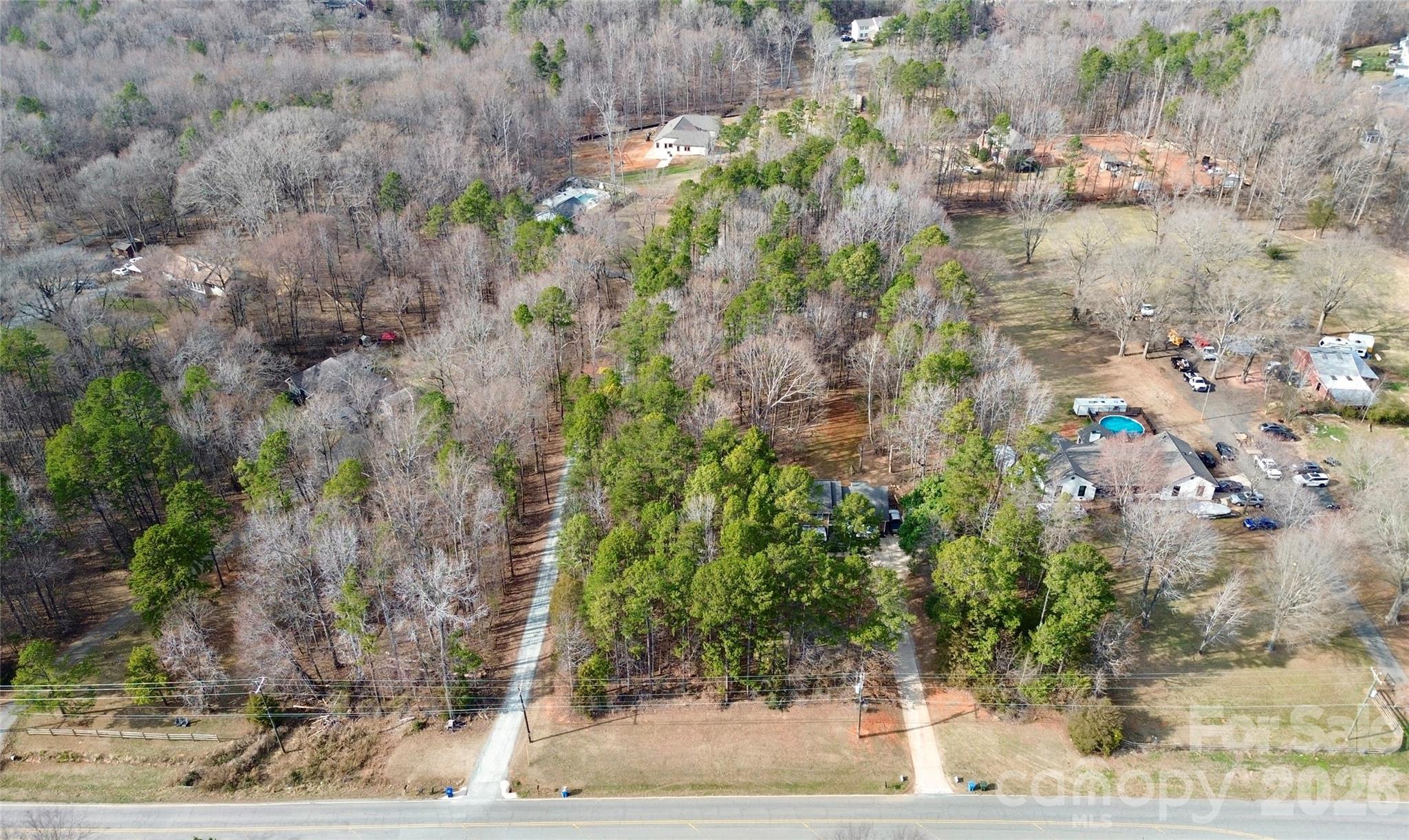 8591 Bartlett Road Mint Hill, NC 28227 - Photo 43 of 45 a view of a yard with plants and tree