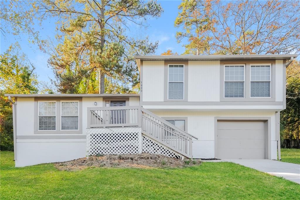 3890 Valpariso Circle Decatur, GA 30034 - Photo 1 of 1 front view of a house with a garden