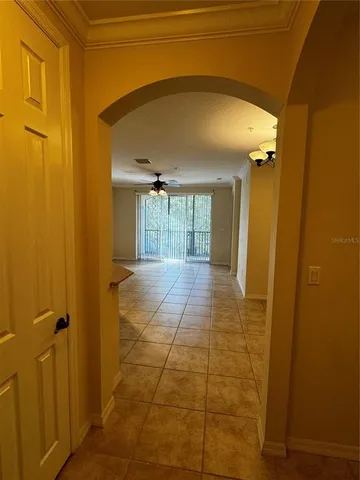 a view of a kitchen and a refrigerator a sink