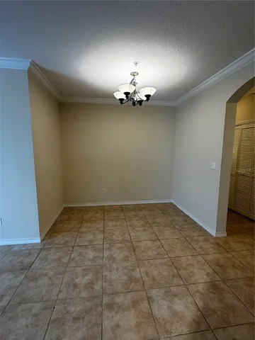 a view of a livingroom with a ceiling fan and window