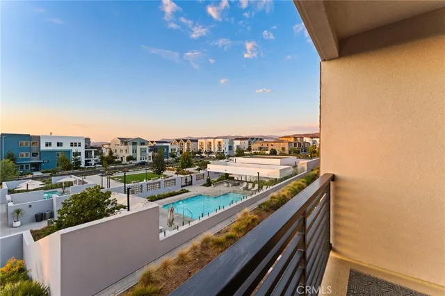 a bedroom with furniture and a large window