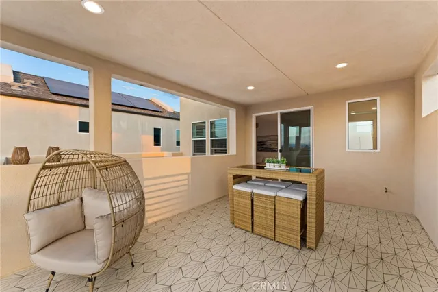 a view of a swimming pool with a lawn chairs