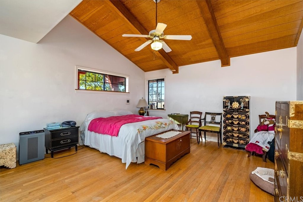 8700 Bee Tree Road Paso Robles, CA 93446 - Photo 29 of 74 a bedroom with a bed and a chandelier