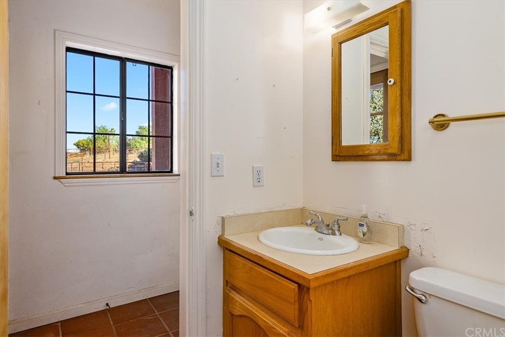 8700 Bee Tree Road Paso Robles, CA 93446 - Photo 34 of 74 a bathroom with a sink and a toilet
