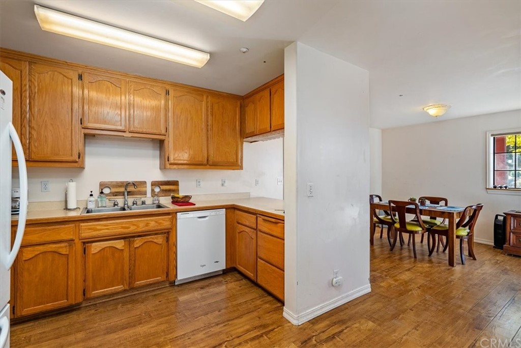 8700 Bee Tree Road Paso Robles, CA 93446 - Photo 36 of 74 a kitchen with stainless steel appliances granite countertop wooden cabinets a stove a sink a dining table and chairs
