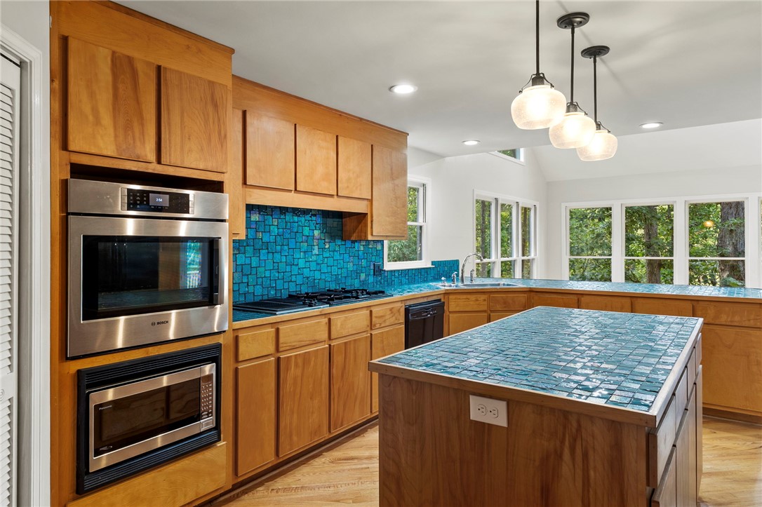 225 Arrowhead Trail Easley, SC 29642 - Photo 2 of 33 This spacious kitchen offers ample cabinetry, a large island, and abundant natural light.