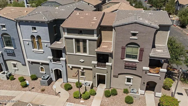 a aerial view of a house with yard and patio