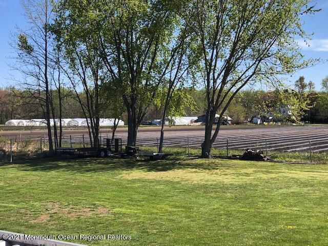 8 Inman Road New Egypt, NJ 08533 - Photo 11 of 18 a view of swimming pool with lawn chairs and large trees