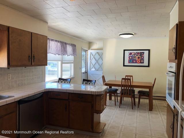 8 Inman Road New Egypt, NJ 08533 - Photo 7 of 18 a kitchen with a sink and cabinets