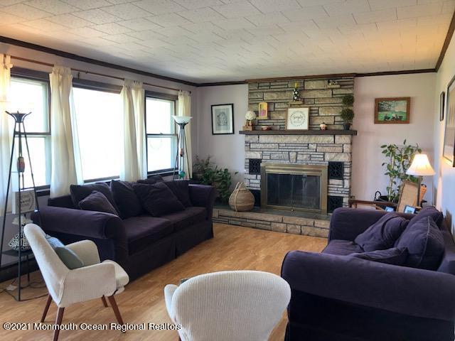 8 Inman Road New Egypt, NJ 08533 - Photo 8 of 18 a living room with furniture a large window and a fireplace
