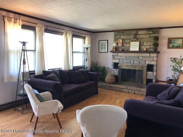 8 Inman Road New Egypt, NJ 08533 - Photo 9 of 18 a living room with furniture and a fireplace
