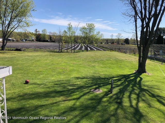 8 Inman Road New Egypt, NJ 08533 - Photo 10 of 18 a view of a lake with a yard