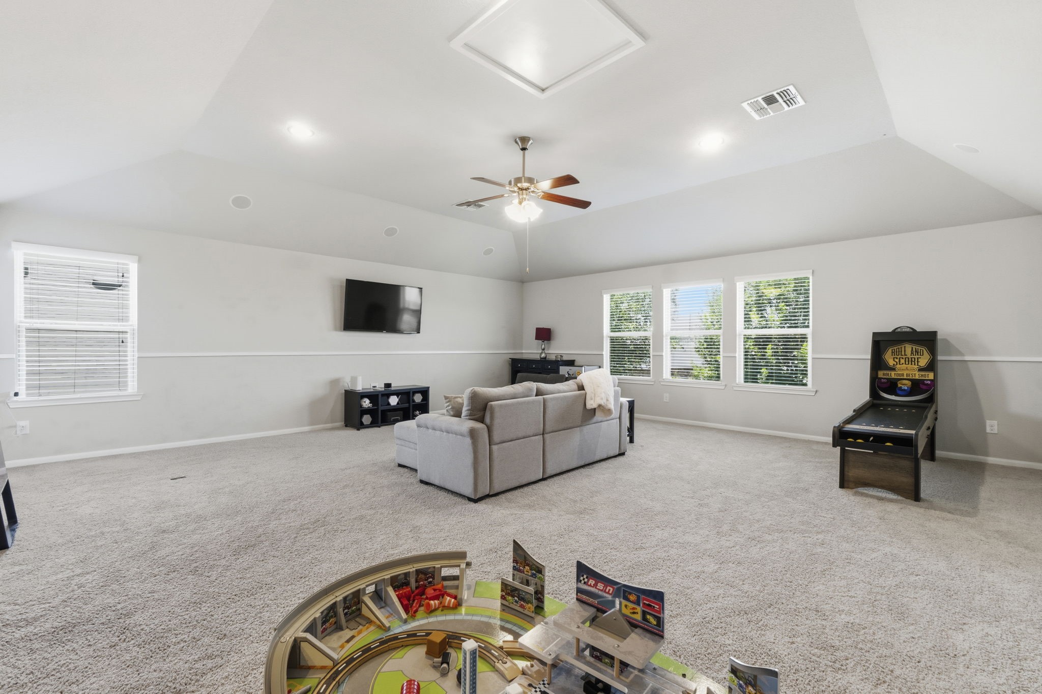 3900 Enchanted Timbers Lane Spring, TX 77386 - Photo 31 of 49 a living room with furniture and a flat screen tv