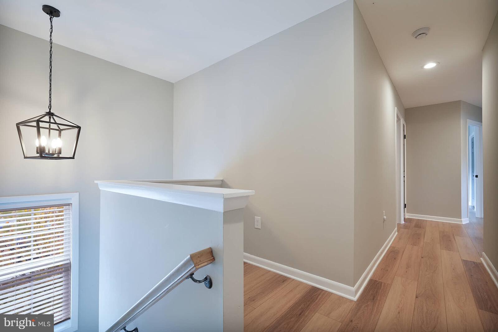 2425 Skyland Place Southeast Washington, DC 20020 - Photo 20 of 41 a view of room with window and wooden floor
