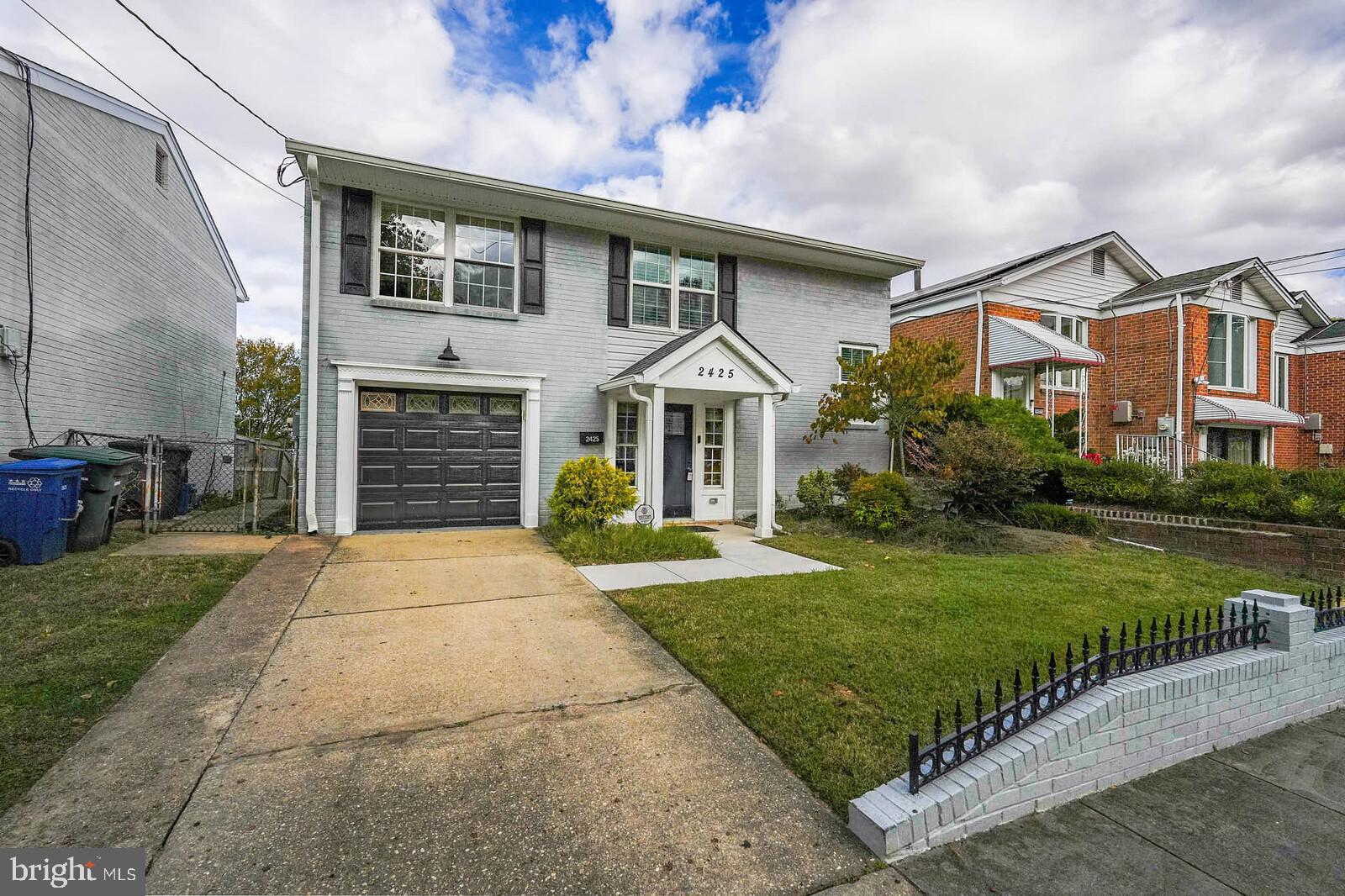 2425 Skyland Place Southeast Washington, DC 20020 - Photo 3 of 41 a front view of a house with a yard