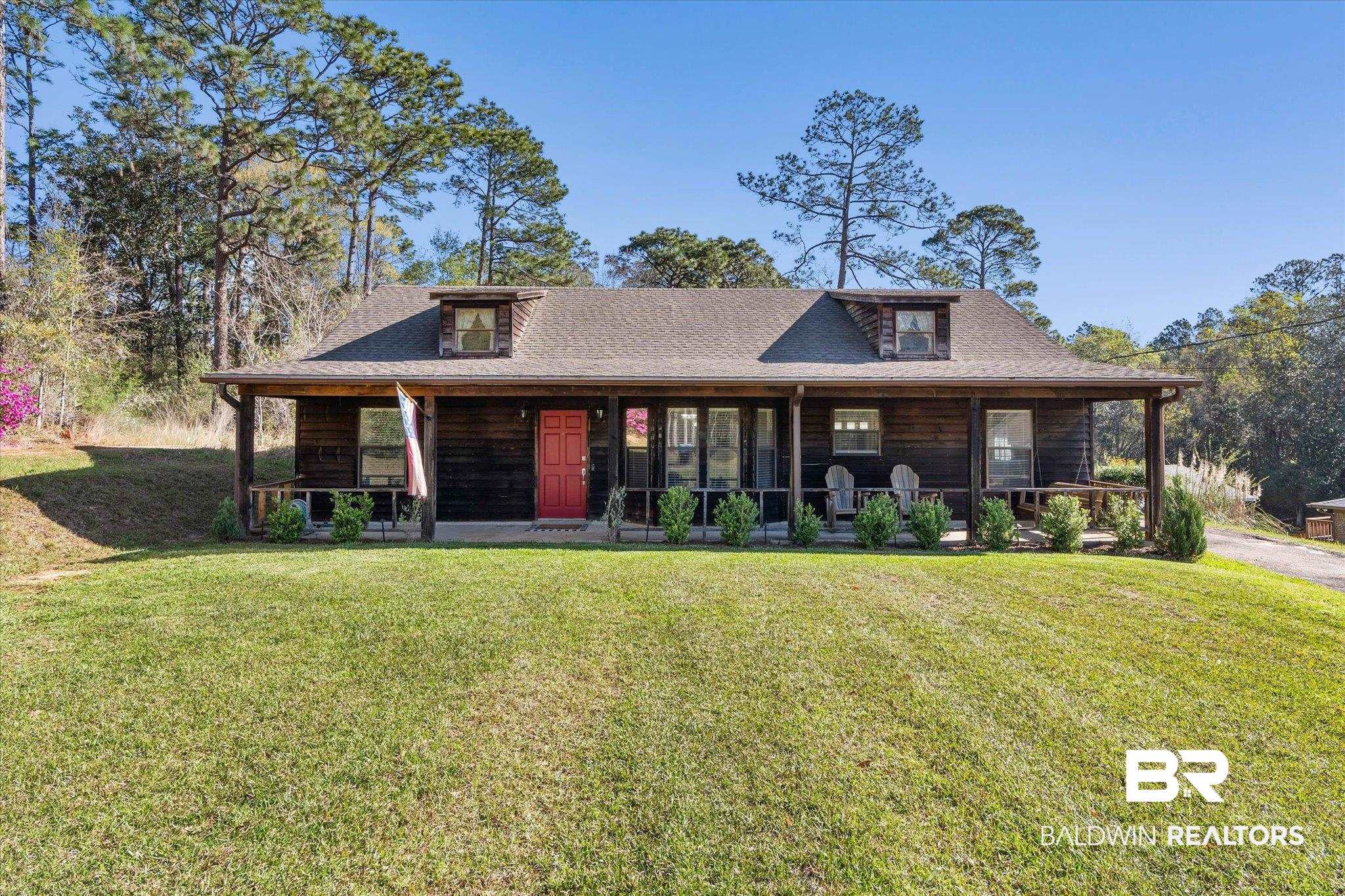 8030 Country Drive Mobile, AL 36619 - Photo 21 of 22 View of front of home featuring covered porch, a front yard, and roof with shingles